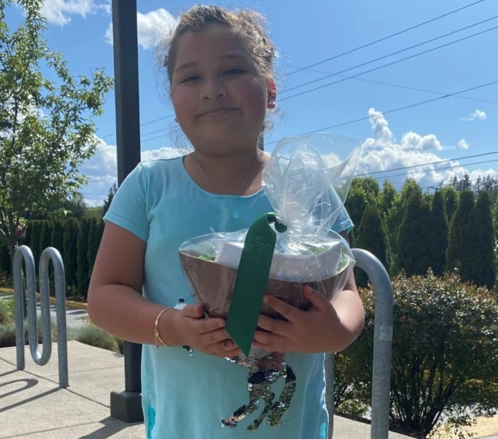 Girl holding reward for making deposits